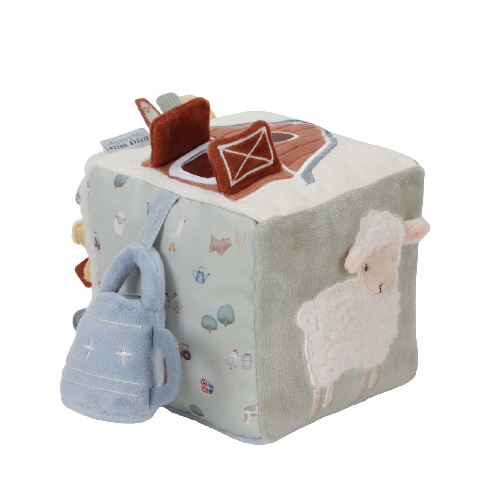 A soft activity cube for babies with farm animals like a sheep and a chicken, and textures like a watering can and a barn, all in a light-colored fabric.