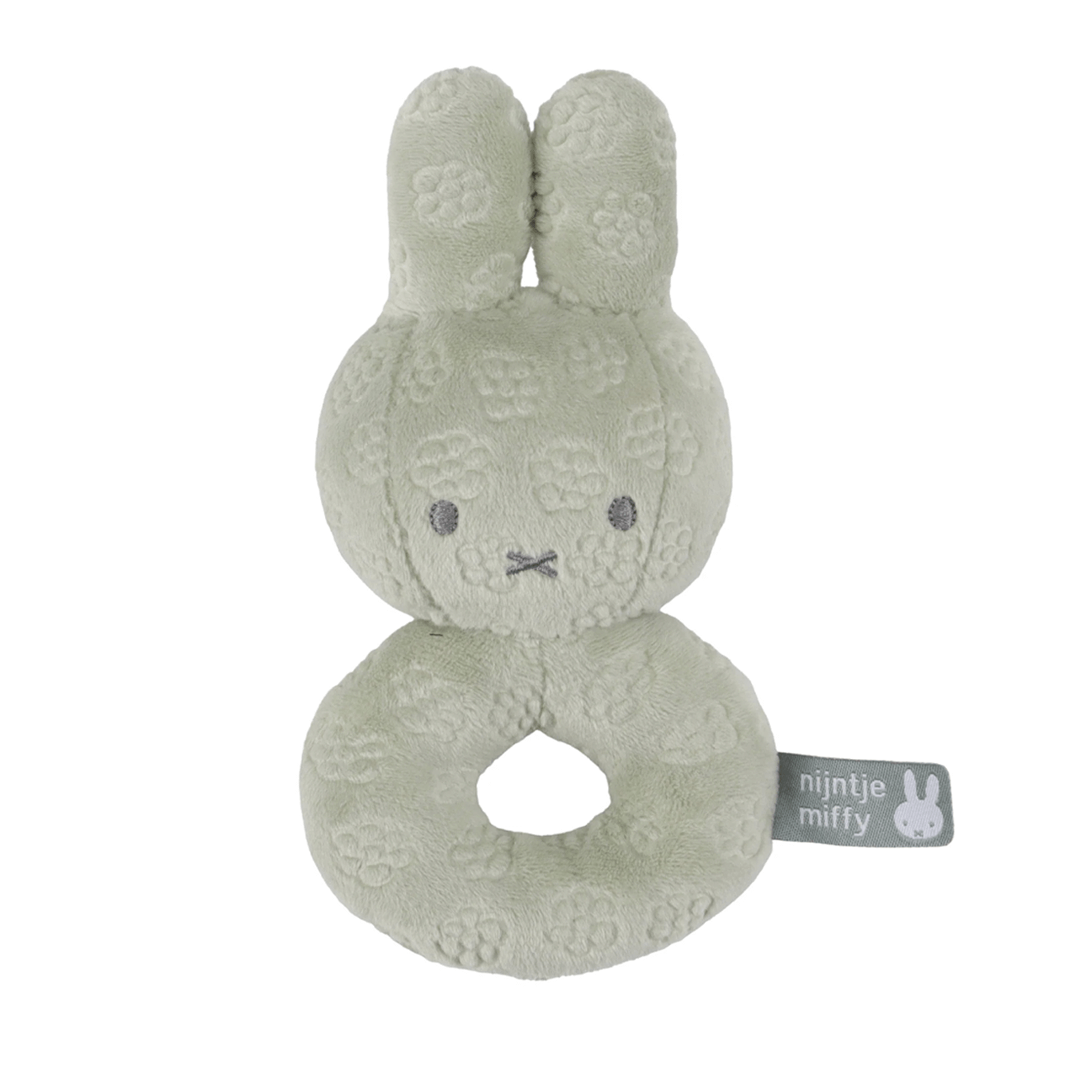 Green textured plush toy with a tag on a white background