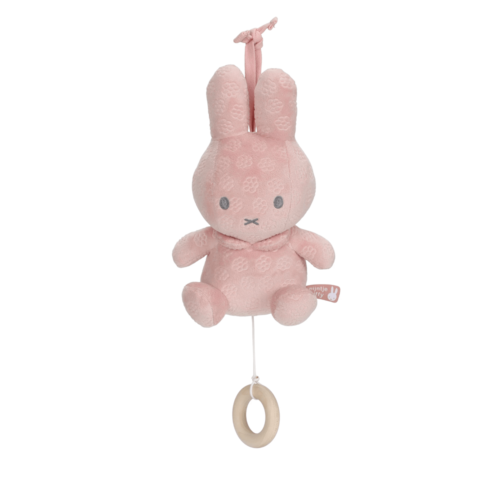 Pink plush bunny toy with a wooden ring on a white background