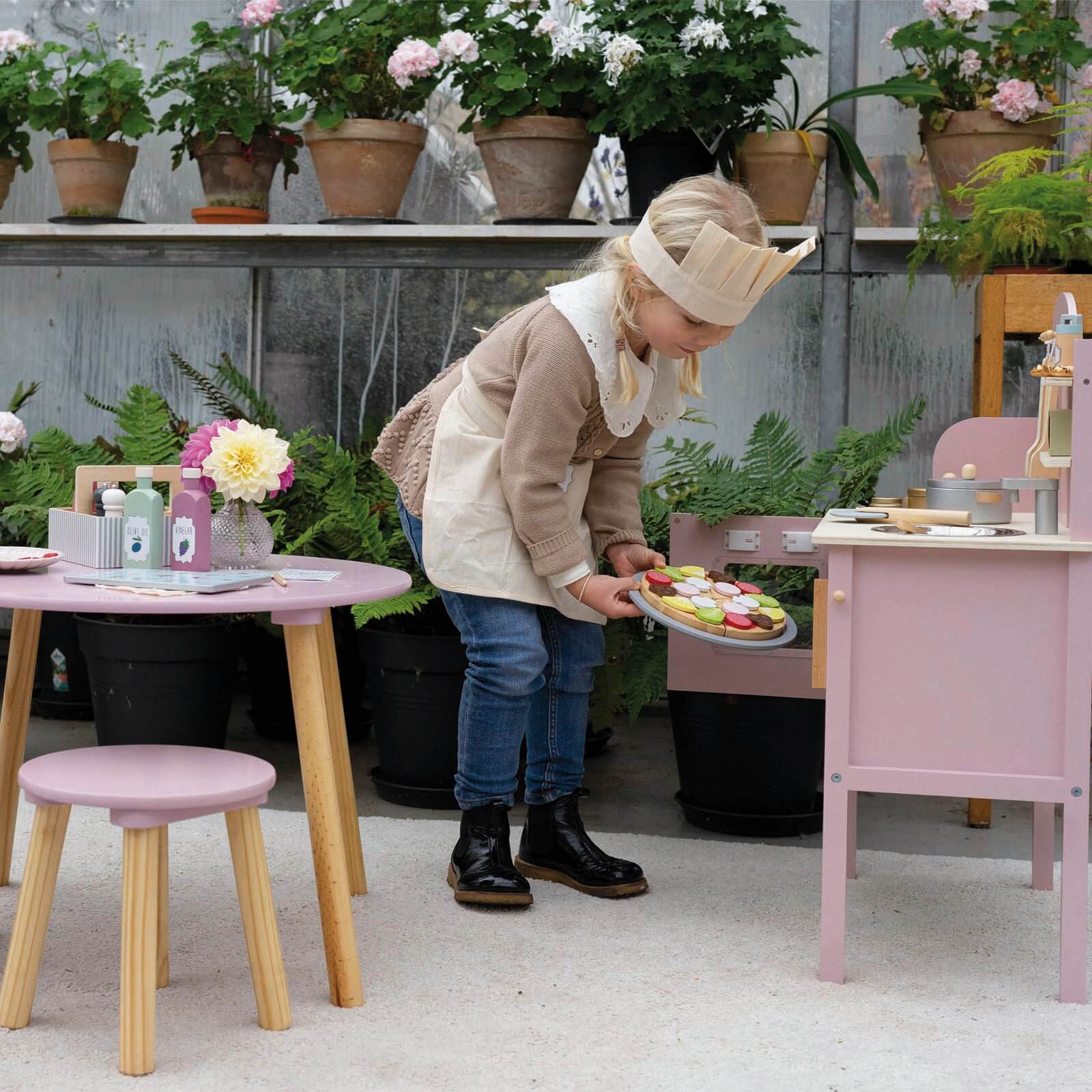 Pink Kitchen with Pots and Accessories