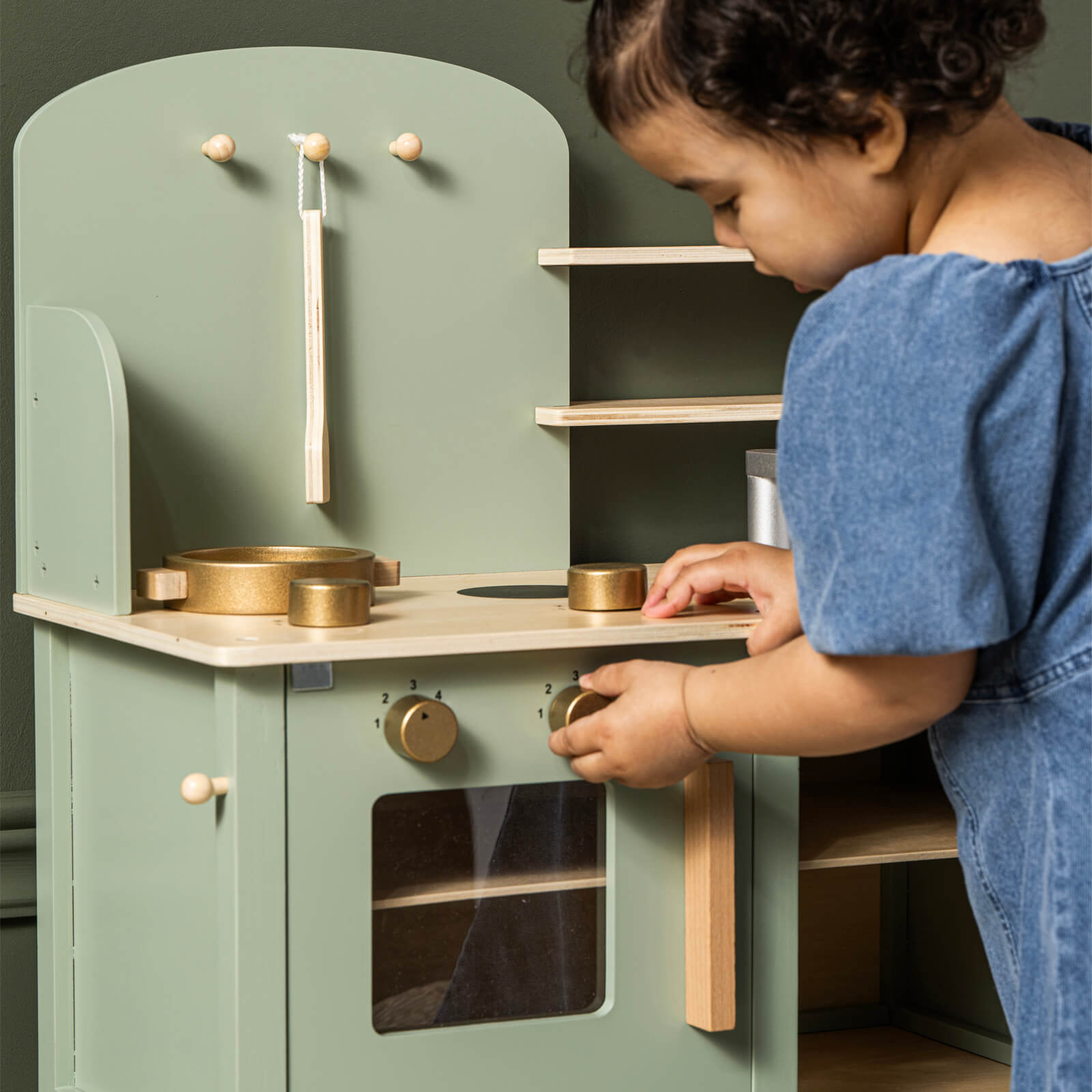 Green Kitchen with Pots and Accessories