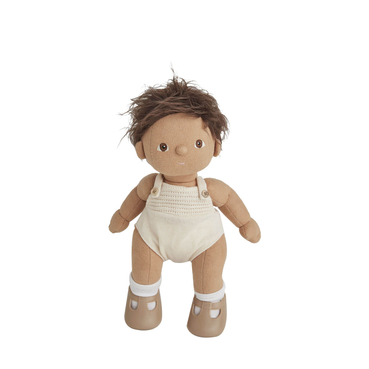 Stuffed doll with brown hair wearing a white romper on a white background